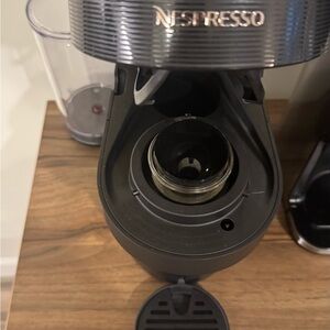 Nespresso Machine with Metallic and Black Finish barely used.